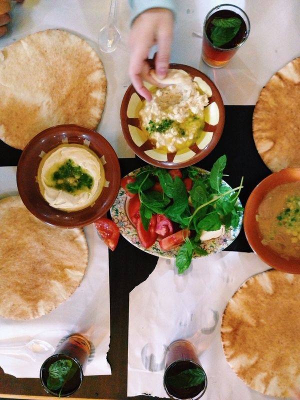 Hommous, pita, falafel and fuul (bean dip), salad at Hashem restaurant. 